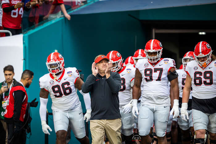 Kirby Smart leads his No. 6 Georgia Bulldogs out of the tunnel to go dominate in the 2023 Orange Bowl. (Brooks Austin / Dawgs Daily).